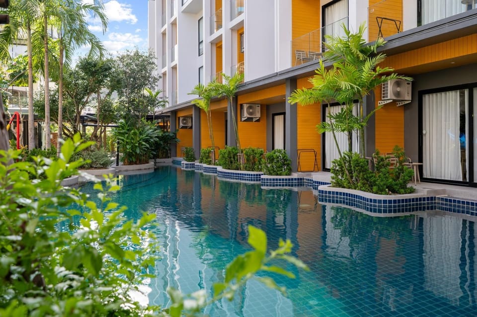 Outdoor Pool / Amenities
Beautiful outdoor pool area with comfortable lounges and landscaped garden features.