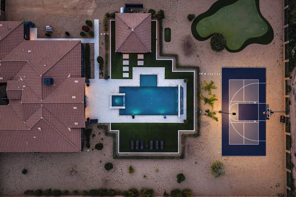 Escape to a property that has everything you want and more! This backyard is perfect for entertaining a family, with a private pool, hot tub, basketball court / pickleball court, putting green, and massive yard!