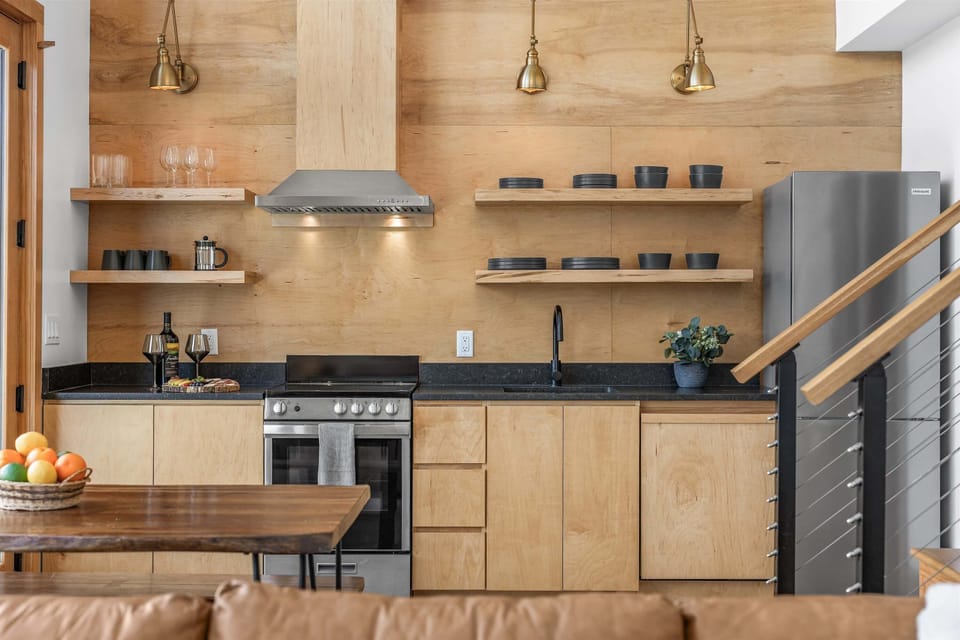 Kitchen with functional oven, cooktop, and dishwasher.
