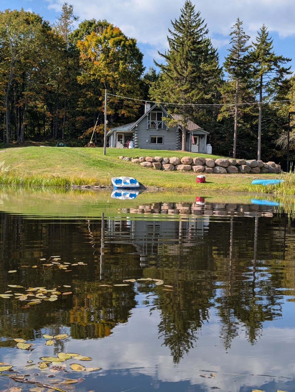 Breathtaking view of the cabin from across the pond.