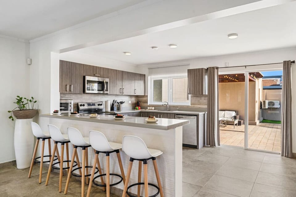 Open kitchen with patio access and island breeze