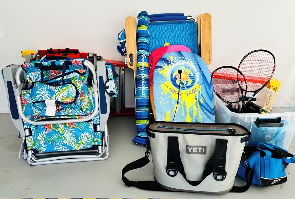 Chairs (hi-boy and low) beach umbrella, cooler, beach bag, boogie boards, bocce