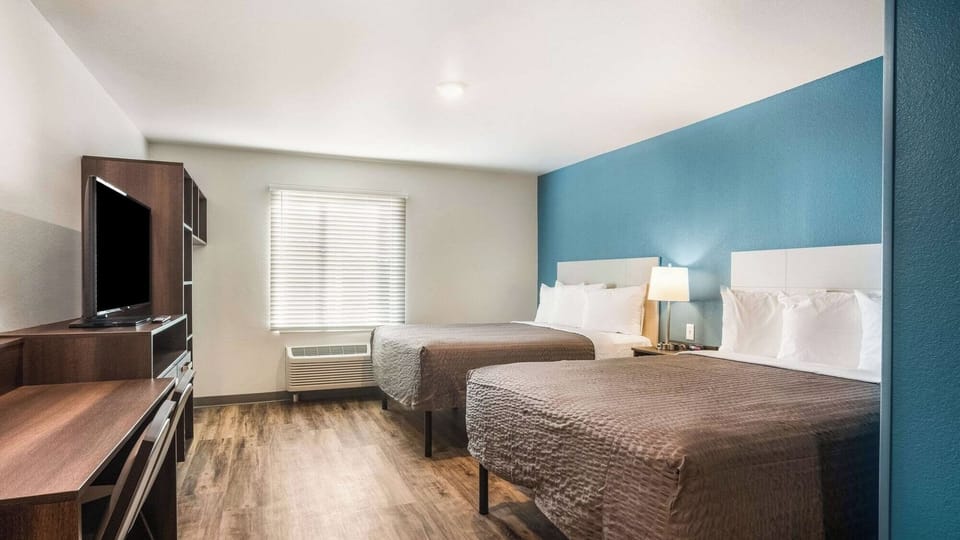 Settle into a bright, spacious room with two plush beds.