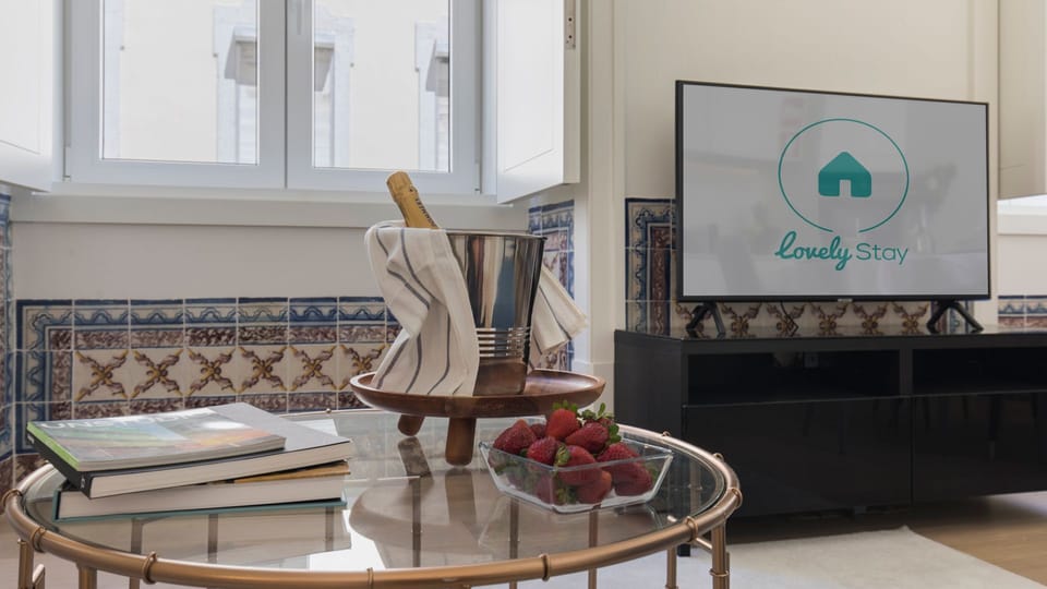 Relax on the soft couch and enjoy catching up on your favorite shows after a long day spent exploring the city.