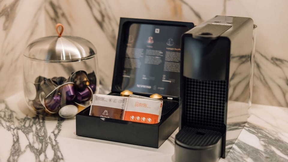 A stylish coffee station with a Nespresso machine and a variety of flavors — perfect for your morning pick-me-up.
 #AndoLiving #Portugal #Santos #CoffeeLovers #ModernLiving