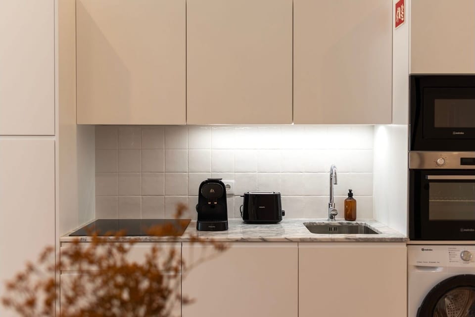 Despite its compact size, this kitchenette is fully equipped with everything you need to create culinary delights.