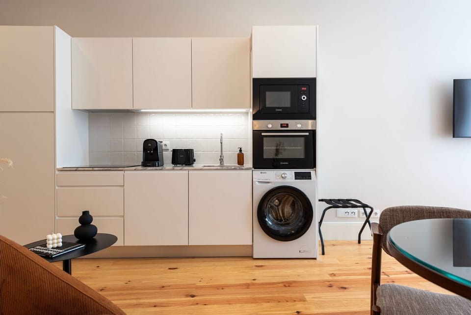 A sleek kitchenette with premium appliances, generous counter space, and all the essentials for effortless cooking.

#ModernKitchenette #FullyEquipped #PremiumDesign #UrbanLiving