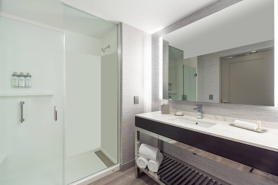 Refresh in a spotless, spa-bright bath with glass shower.