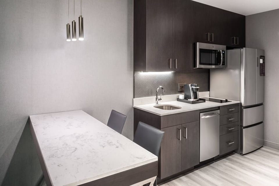 Cook and sip coffee easily in the sleek modern kitchen.