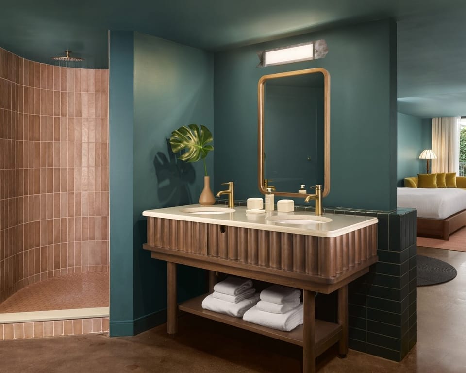 Refresh effortlessly with spa-style vanity and warm rainfall shower.