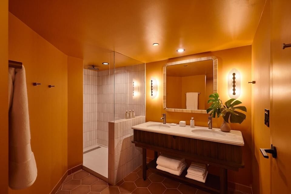 Refresh under the rain shower in a warm, spa-like bath.