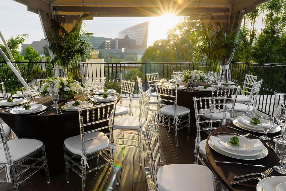 Savor sunset cocktails on the panoramic terrace dining setup.