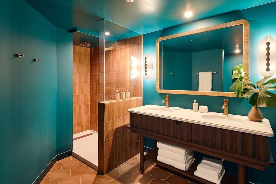 Refresh in a spa-like bath with double vanity and walk-in shower.