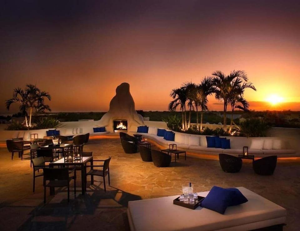 Soak up breathtaking sunsets from the rooftop lounge and firelight.