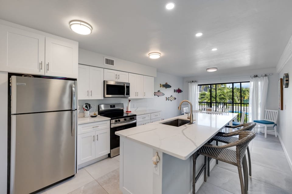 Newly remodeled kitchen with dining area and patio