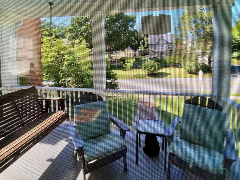 Front porch with view of Washington Street and town park