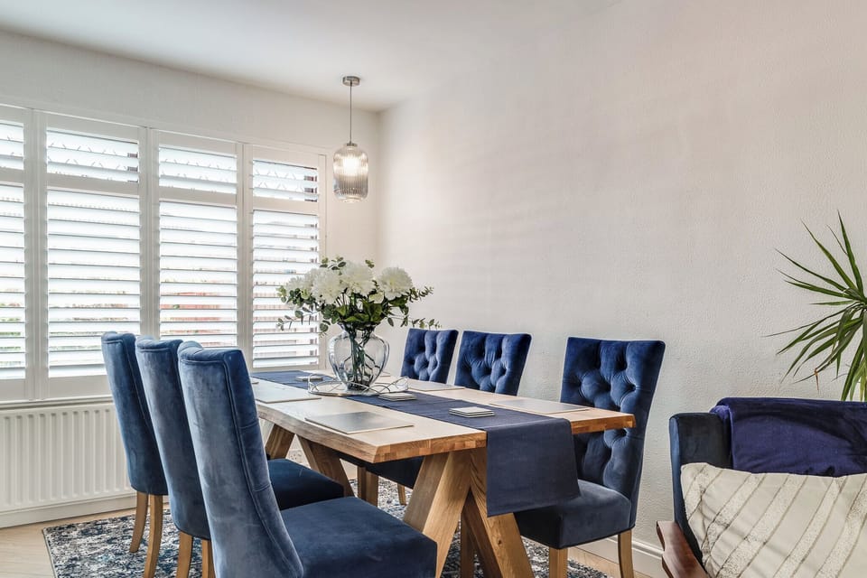 Share meals and make memories with family or friends around a bright, inviting dining table.