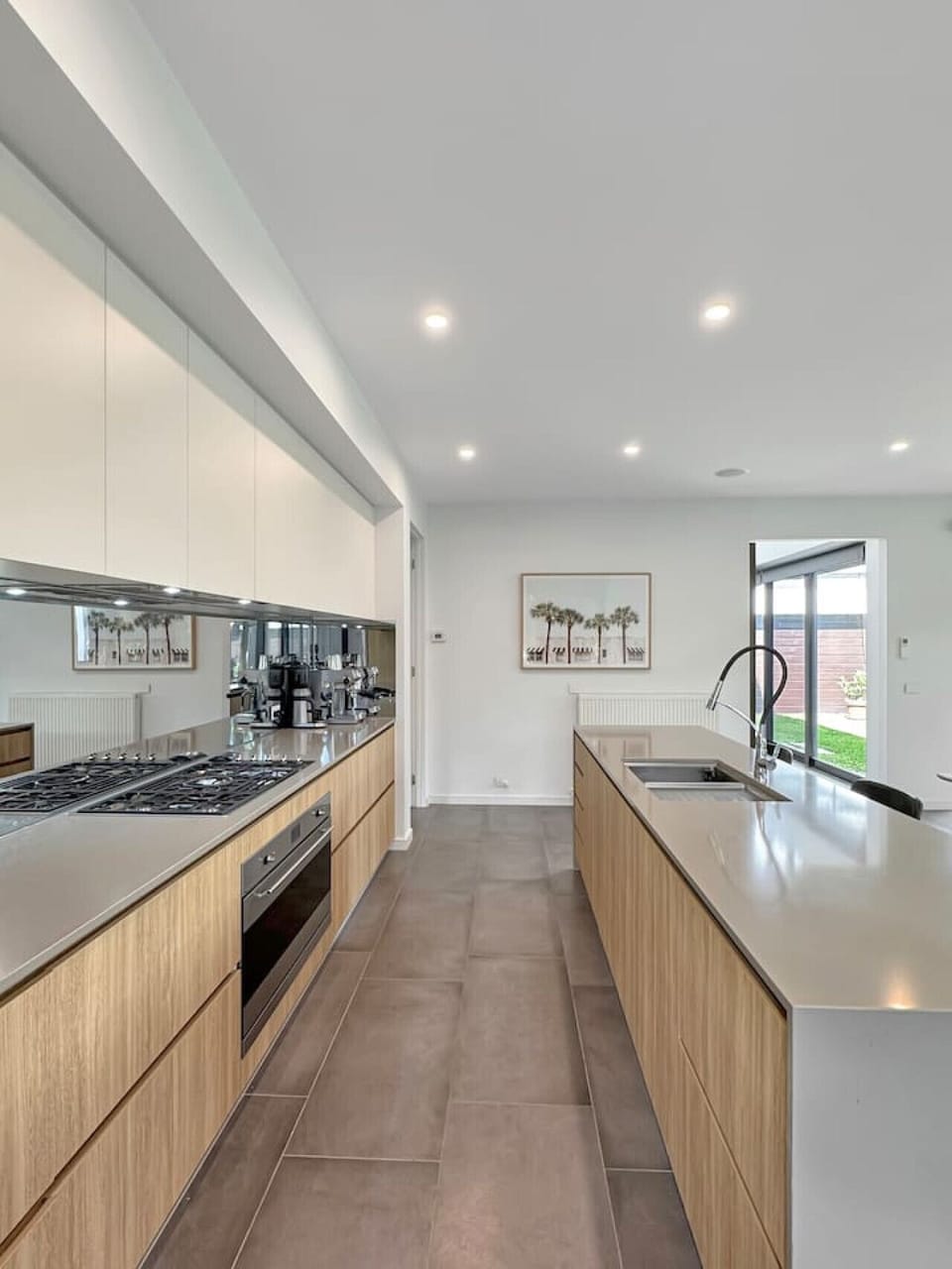 A sleek, modern kitchen with a spacious island, quality appliances and clean, contemporary finishes, perfect for cooking and entertaining