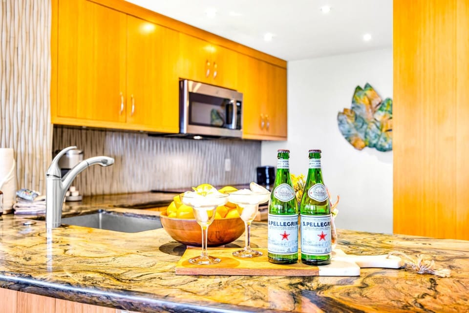 Fully equipped kitchen with granite counters and breakfast bar makes meal prep a breeze.