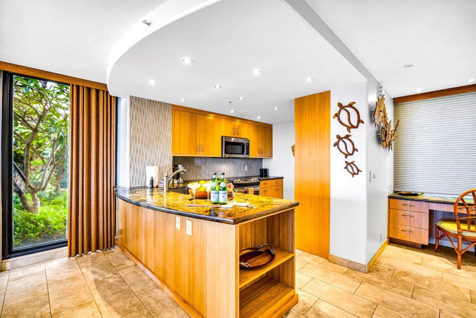 Kitchen layout offers ample storage and full-size appliances.