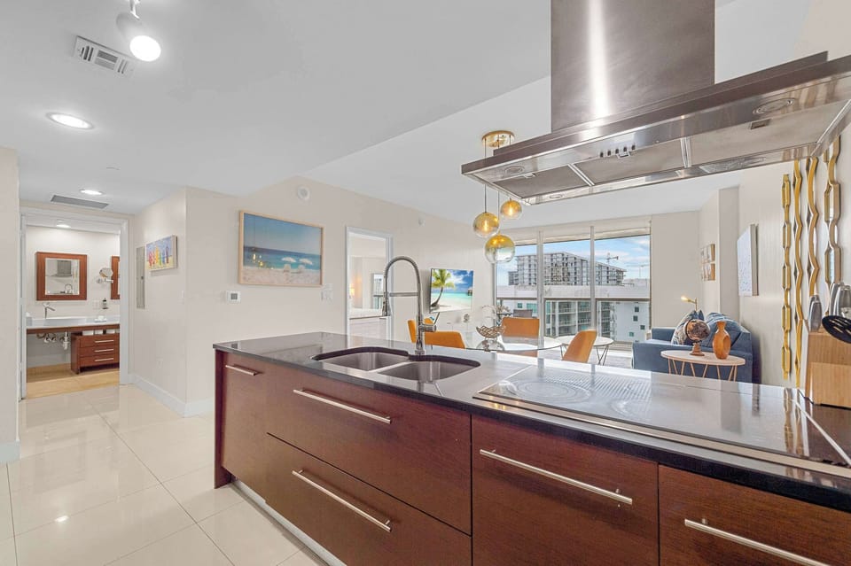 Contemporary kitchen with premium wooden cabinetry and high-end finishes.