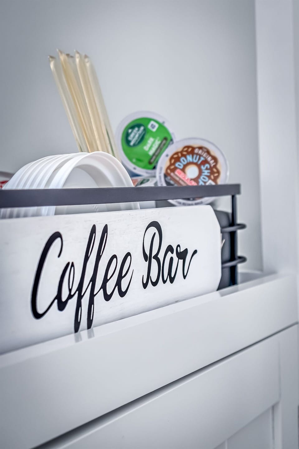 Provided coffee essentials: k-cups, creamers, stir sticks, honey sticks, pre-measured 10 cup coffee pods