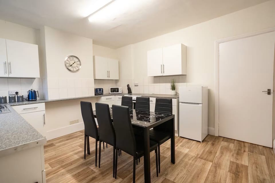 Dining area with fridge in the background