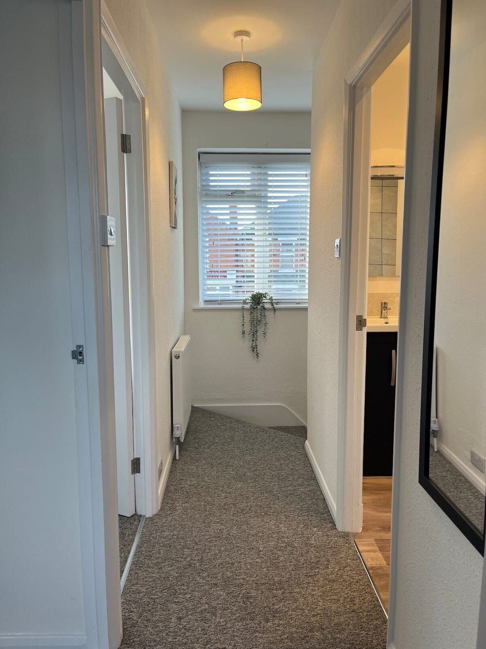 Light and airy first floor landing leading to the main bathroom l, bedrooms 1, 2 & 3, with front garden and street view.
