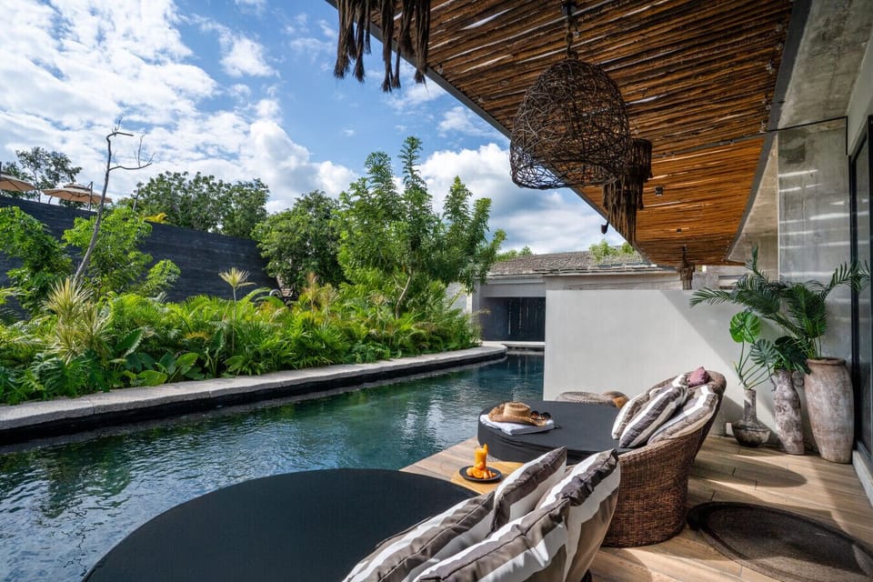 Enjoy your own secluded oasis featuring a refreshing plunge pool, stylish outdoor seating, and lush surroundings designed for ultimate relaxation.