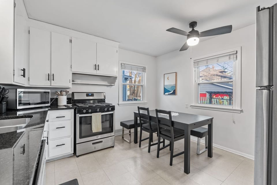 Whip up delicious meals in your sleek, fully-equipped kitchen with modern appliances, ample counter space, and a cozy dining nook perfect for morning coffee.