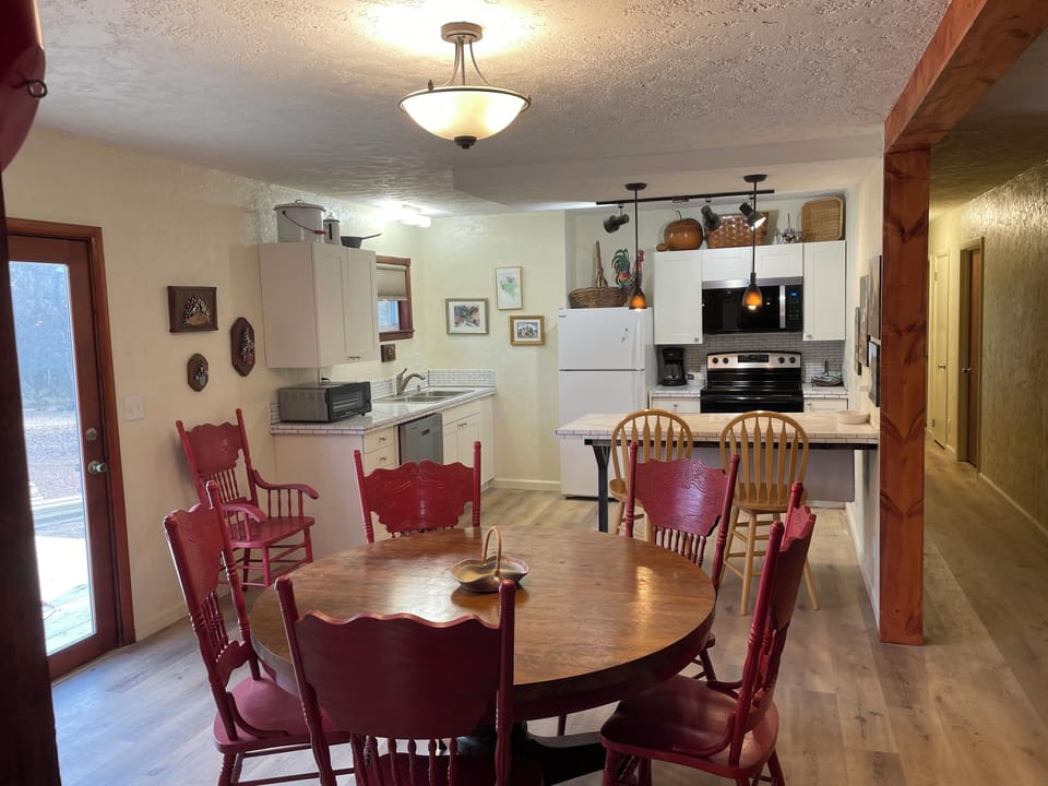 Dining and kitchen area.  Back deck out the door to the left.