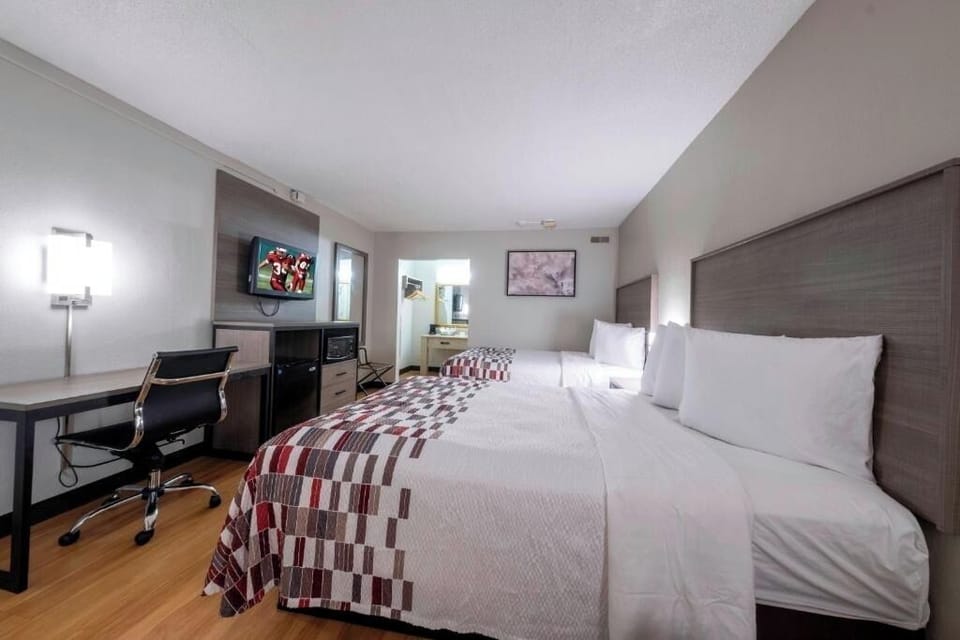 Unwind after adventures in crisp beds with in-room workspace.