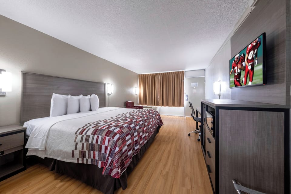 Stretch out after exploring with TV, desk, and plush bed.