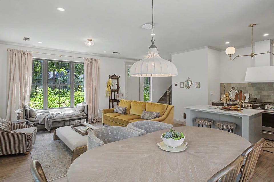 Stylishly decorated main area that includes kitchen, dining, and living room