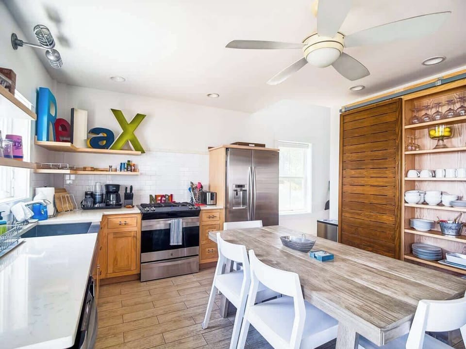 Another kitchen angle highlighting open layout & seamless flow to dining.