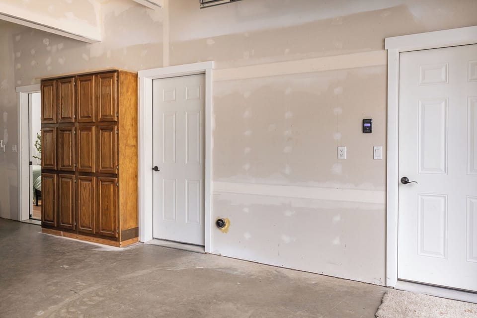 Left is the bedroom, middle is the bathroom, right leads to the entryway.