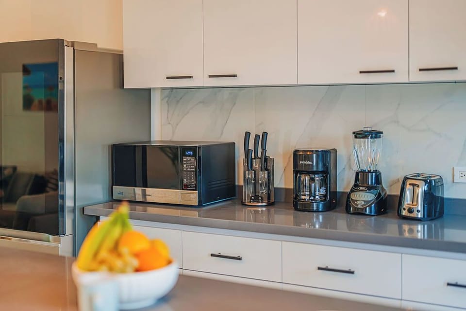 Kitchen fully equipped for cooking at home.