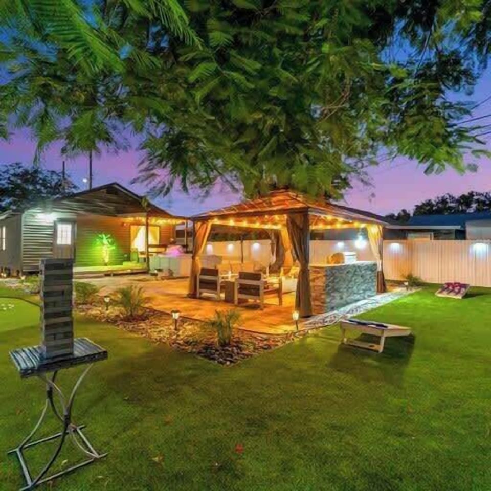 Game on! Enjoy giant Jenga, cornhole, and more in our vibrant backyard lounge