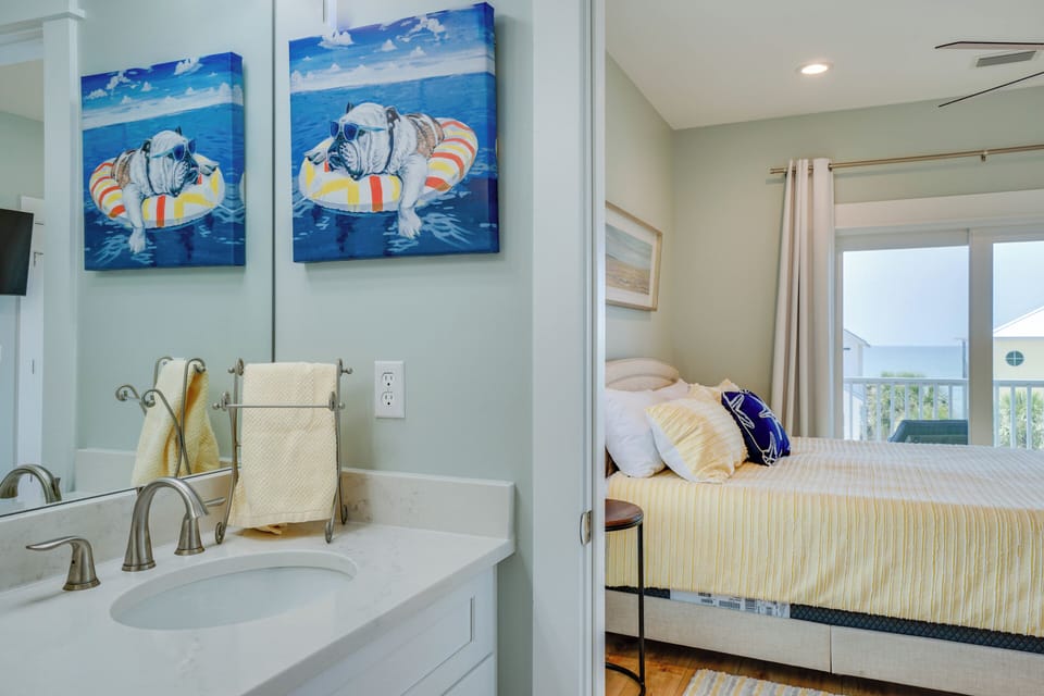 Your bright bathroom connects seamlessly to your comfortable bedroom, creating a refreshing coastal sanctuary for your stay.