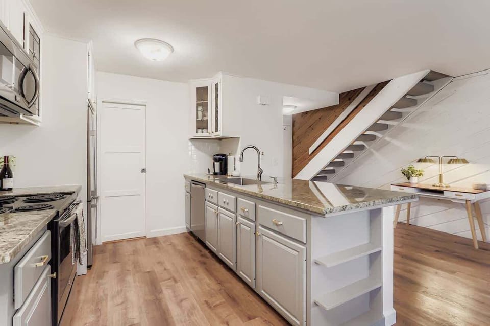 Kitchen with the view of the stairs leading up to the bedrooms 