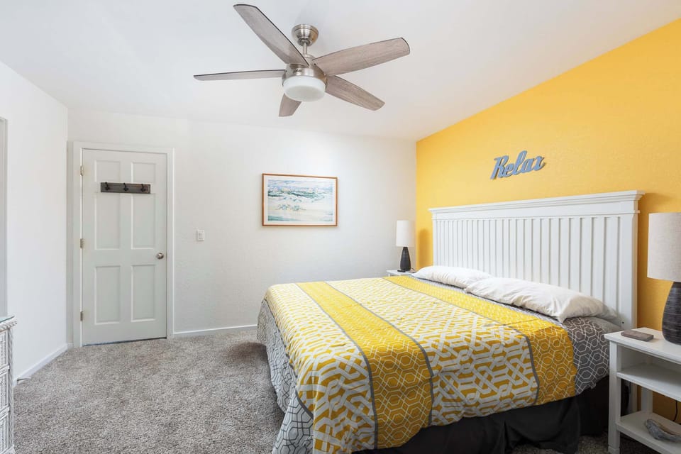 Mid Level: King Primary Bedroom w/ Private Deck Access, Smart TV, and En Suite Bathroom