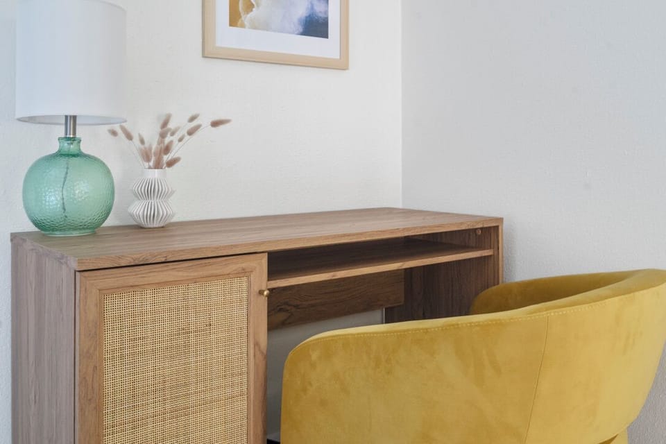 If you need to work on vacation—an in-bedroom workspace for remote days and quick check-ins is just for you