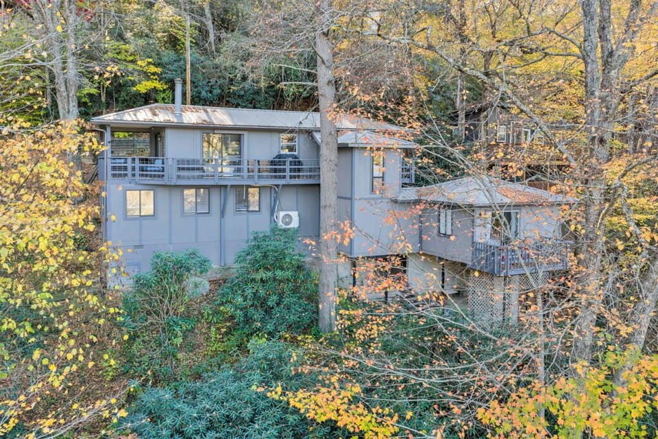 Outside view of the back of the house.  Balcony on left has hot tub, grill, seat