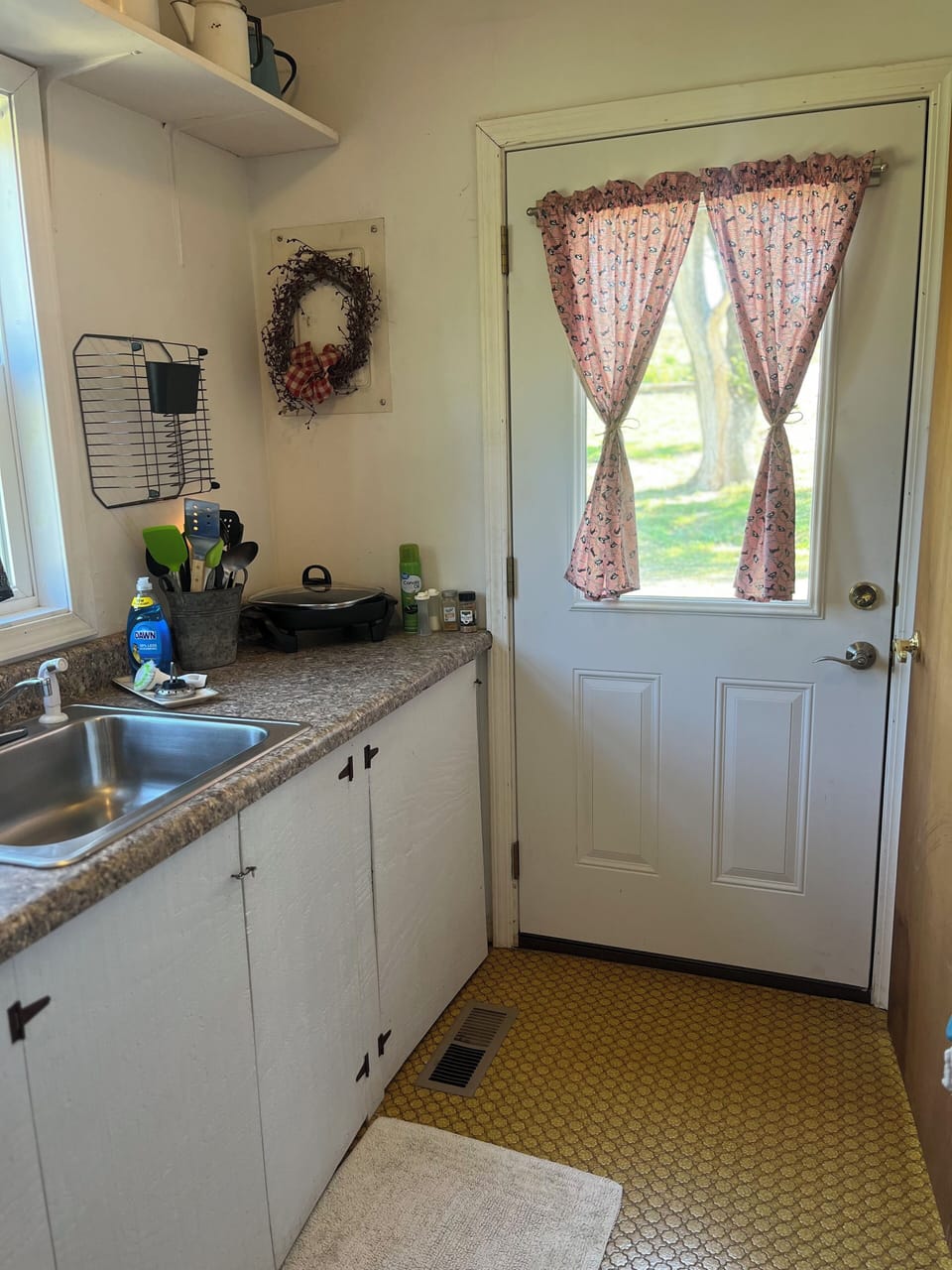 Kitchen area with back door access 
