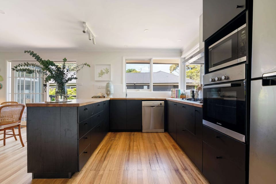 Sunlit kitchen with modern appliances and country charm