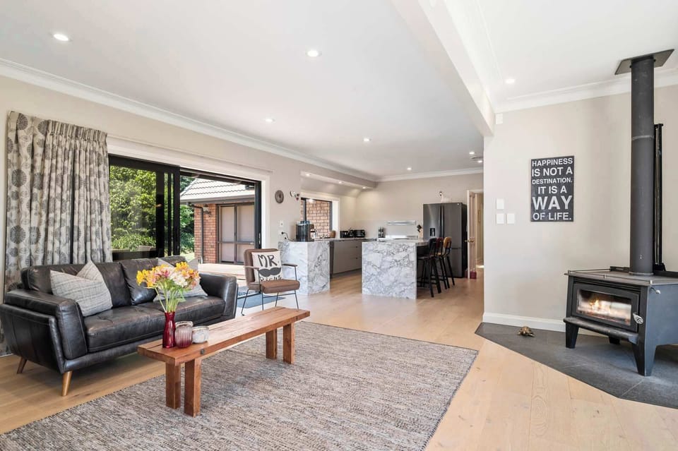 Open plan living room with wood-burner fire