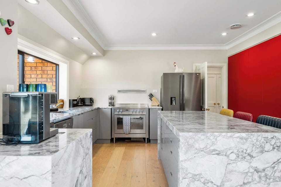 The house features an entertainer's kitchen with full granite bench-tops, a coffee machine, double fridge, an over sized oven and of course a dishwasher.