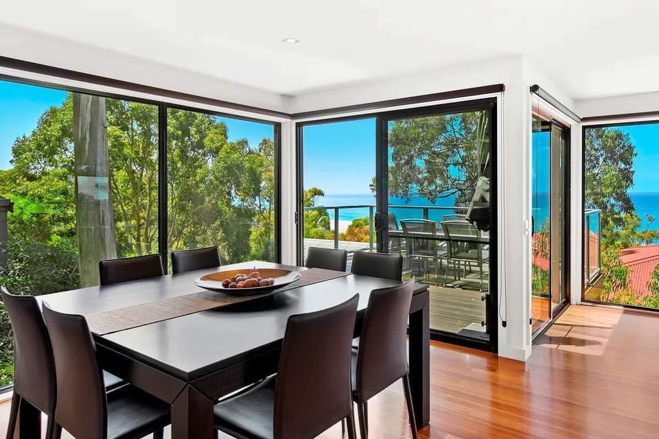 Airy Dining Area Surrounded by Treetop Views