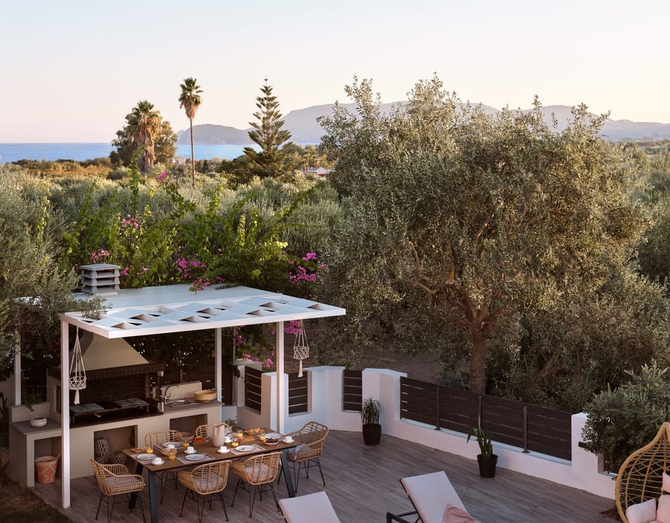 Gather beneath shaded elegance for relaxed meals 