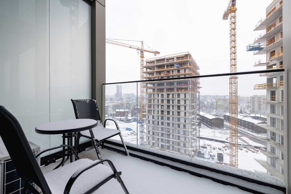 Furnished balcony with a view of the surrounding area.